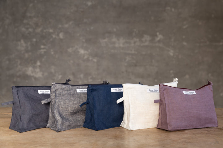 Handmade zero-waste linen cosmetic bag in soft beige, crafted from repurposed high-quality linen fabric.